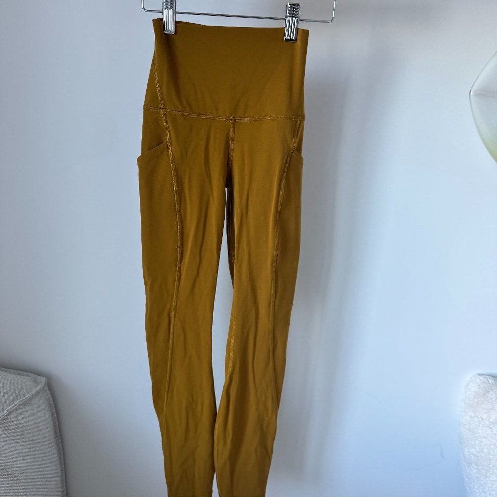 Lululemon Wunder Train High-Rise Tight 25" With Pockets in Mustard
